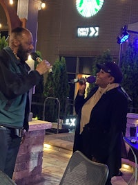 a man talking to a woman at a starbucks