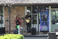 a group of people playing music outside of a building
