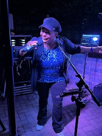 a woman singing into a microphone