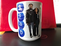 a coffee mug with a picture of a man and a woman